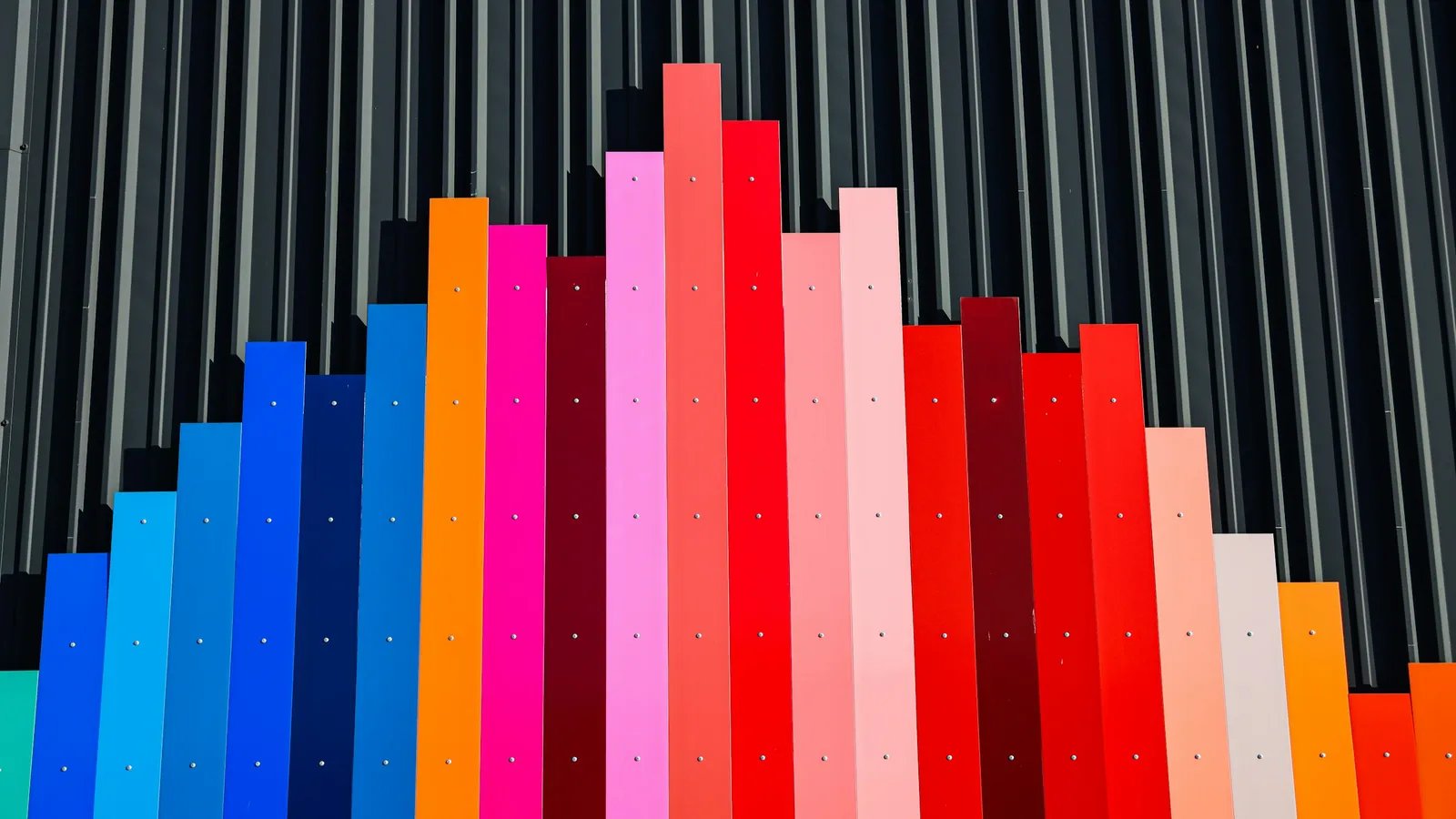 A bar chart of bright coloured bars rising and falling